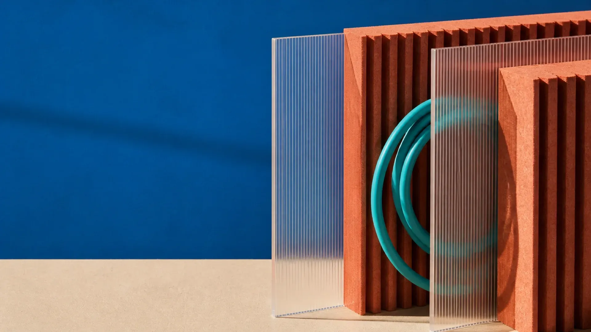 Ribbed panels and translucent dividers with a single turquoise cable